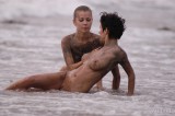 Yummy cuties fool around on the beach.