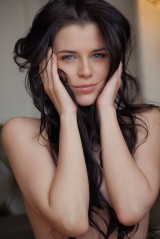 Dark haired gal showing her shaved vagina