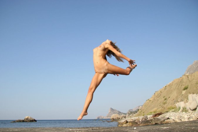 Blonde darling posing near the sea photo 14