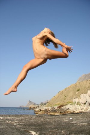 Blonde darling posing near the sea photo 15