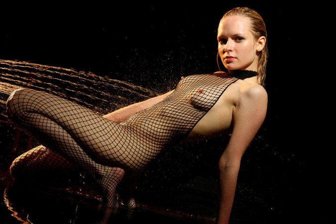 Ginger cutie poses in a fishnet catsuit photo 14