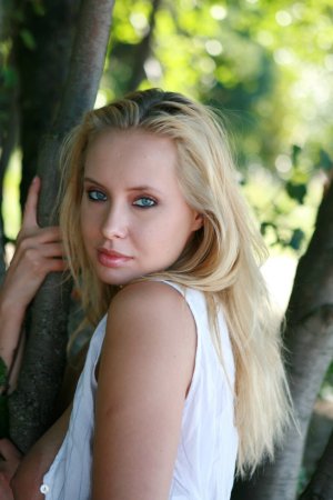 Blondie plays with her body, flowers, bushes and trees. photo 3