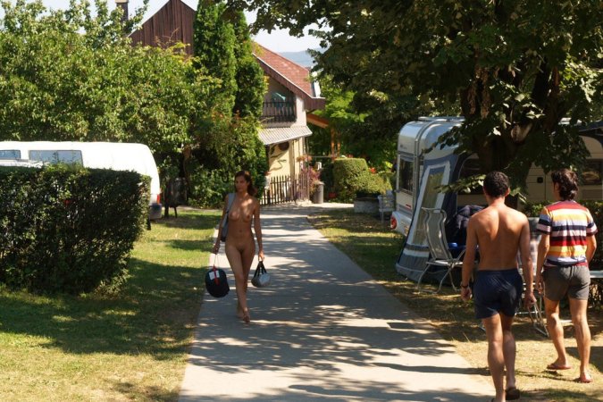 Daring babe walks around in public naked photo 16