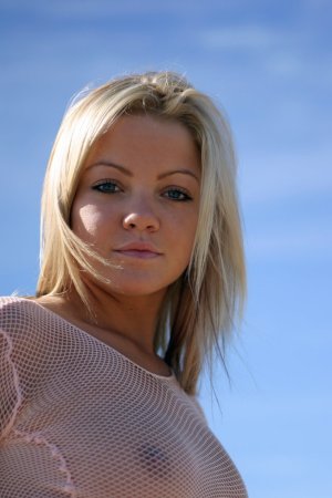 Blonde angel sunbathes in the nude photo 15