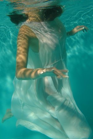 Slim babe with big boobs swims in the outdoor pool photo 12