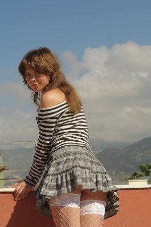 Naughty schoolgirl gets naked on the roof photo 19