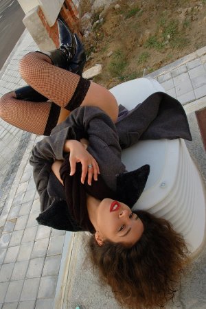 Stunning brunette lady showing her sexy body outdoors photo 18