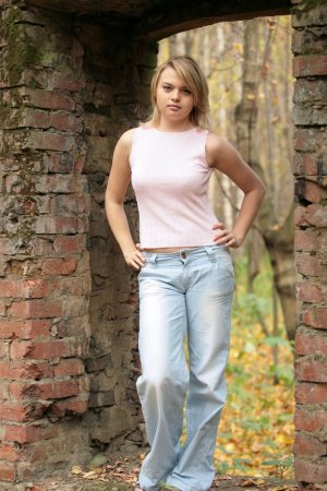 Taking off her jeans with great passion photo 18