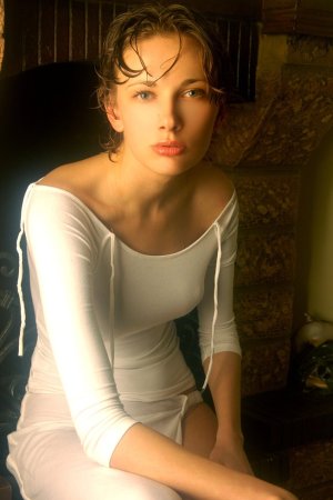 Horny lady in white dress is demonstrating solo skills photo 5