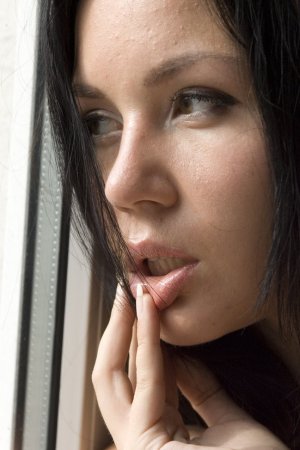 Brunette is enjoying sweet solo next to the window photo 2