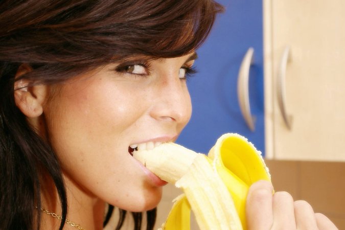 Busty brunette is having solo and eating tasty fruits photo 11