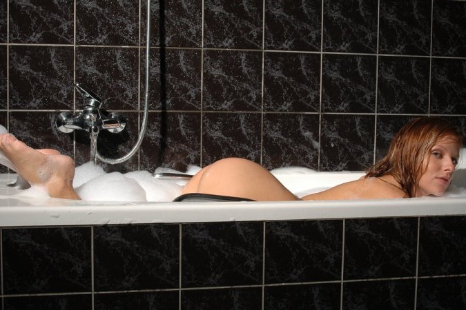 Naked hottie takes soapy bath and masturbates at once. photo 19