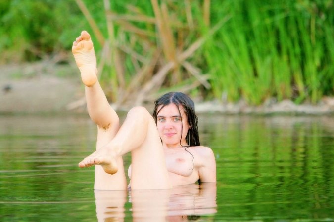 Wonderful girl is having solo in the river photo 3