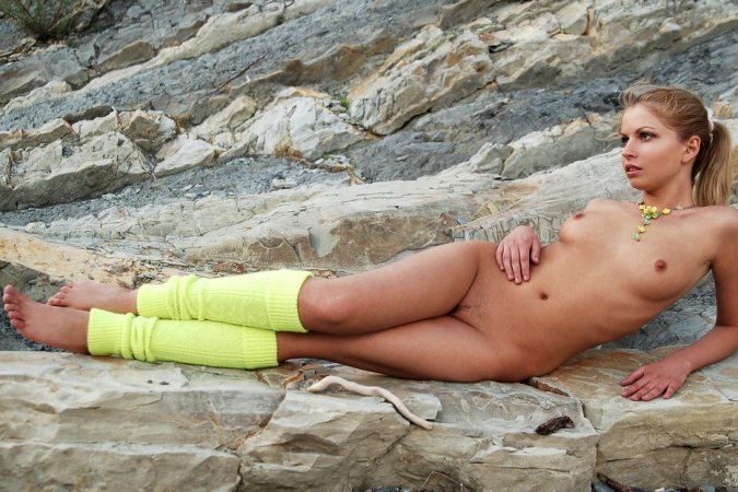 Sweet girl stripteases on a walk along the seaside. photo 13