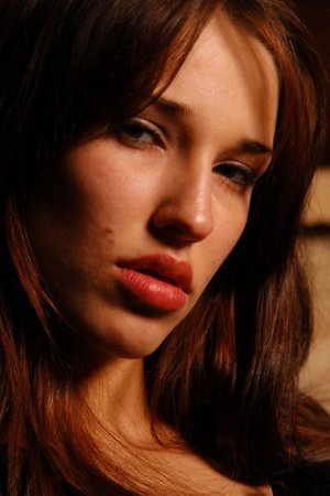 Making a hot show of taking off her lingerie photo 5