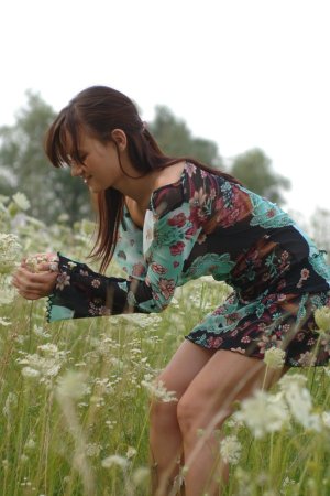 Naked chick lies down in the middle of the meadow. photo 11