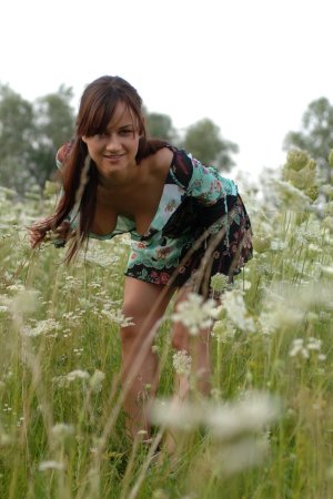 Naked chick lies down in the middle of the meadow. photo 12