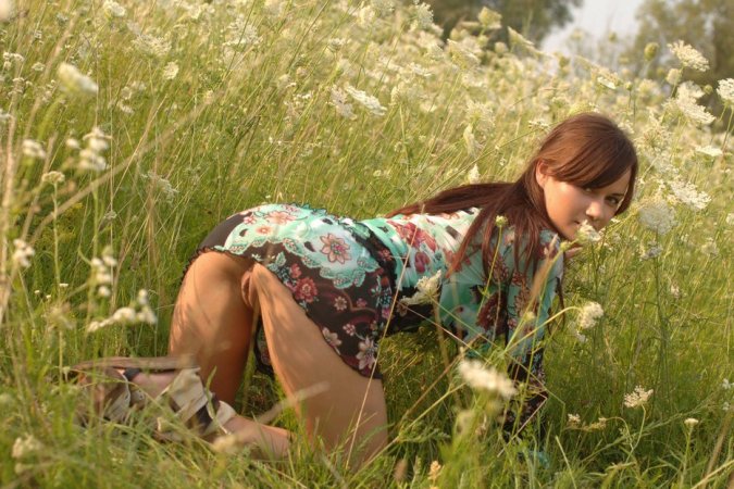 Naked chick lies down in the middle of the meadow. photo 17
