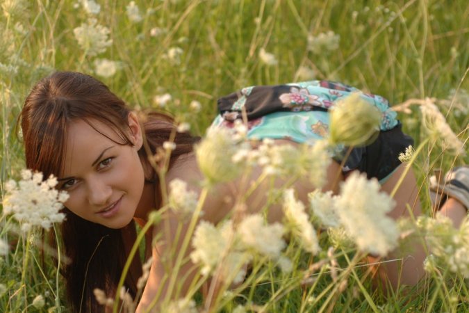 Naked chick lies down in the middle of the meadow. photo 18