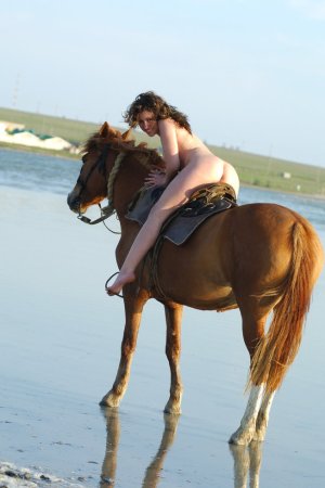 Cutie rides a horse without any clothes on her body. photo 20