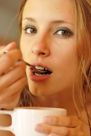 Cutie drinks her morning coffee in bed photo 15