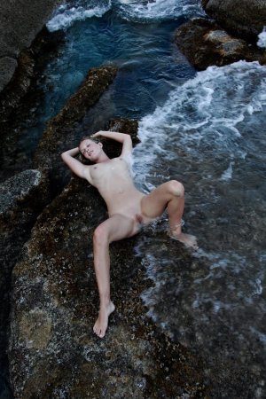 Frisky babe swims naked in the sea photo 10