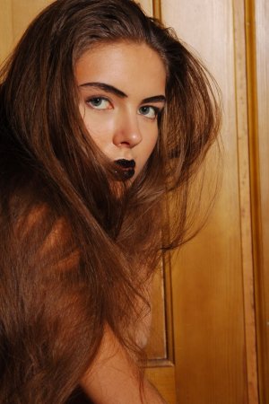Tattooed brunette is touching her sweet naked body photo 1
