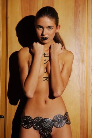 Tattooed brunette is touching her sweet naked body photo 19