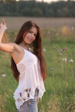 Naked babe rubs pussy in the field photo 4