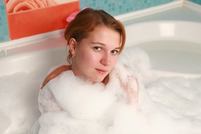 Two chicks are enjoying closeness in the bathtub photo 19