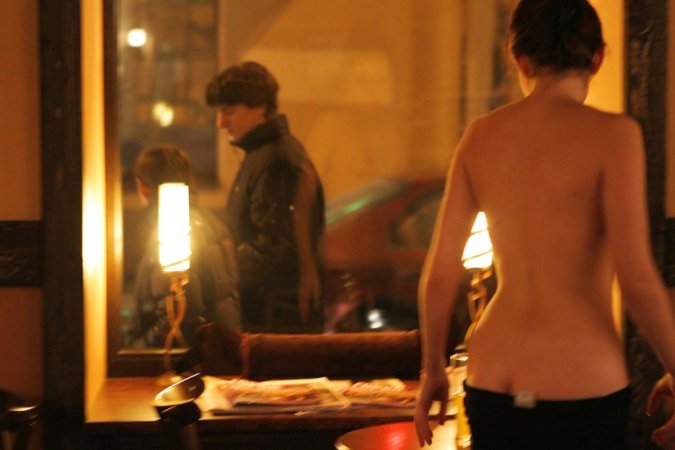 Naked cutie drinks cocktail in a bar photo 6