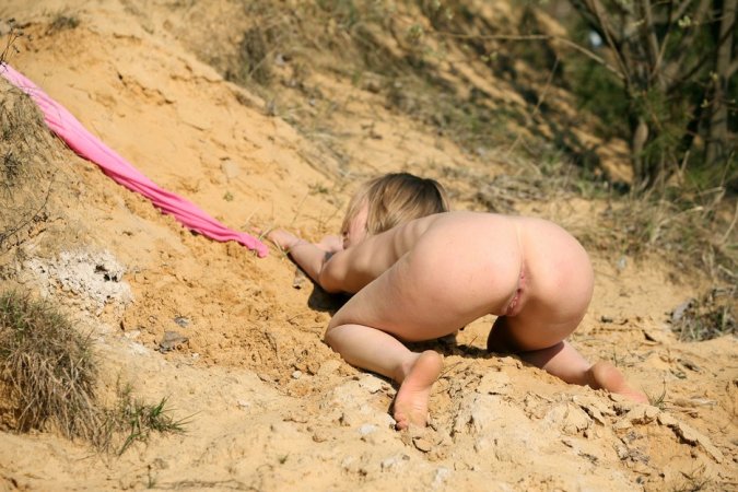 Soaking up the desert heat in the nude photo 5