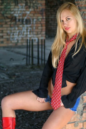Striking blonde in nothing but knee high boots photo 5