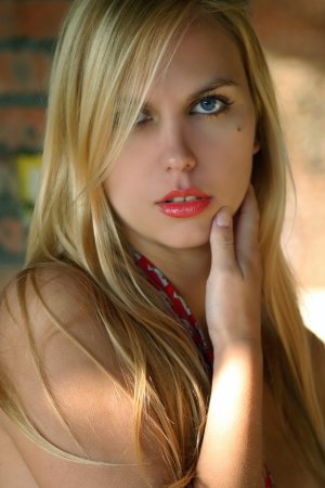 Striking blonde in nothing but knee high boots photo 19