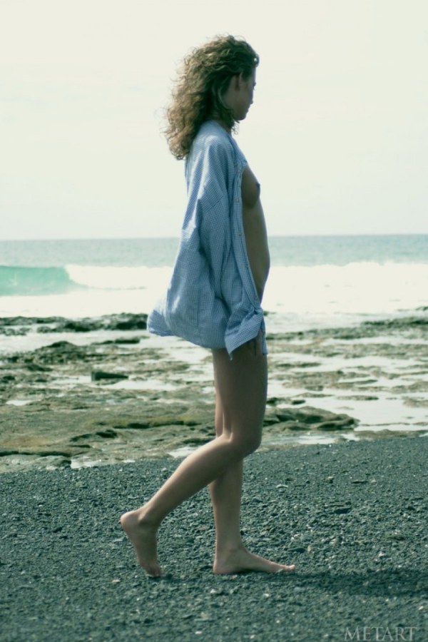 Betty A – Curly haired blondie posing on the beach