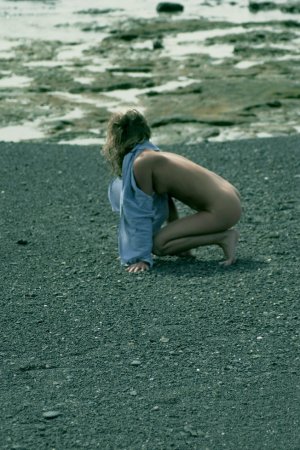 Curly haired blondie posing on the beach photo 2