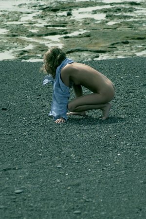 Curly haired blondie posing on the beach photo 8