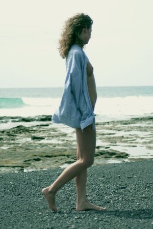 Curly haired blondie posing on the beach photo 14