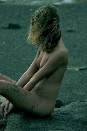 Curly haired blondie posing on the beach photo 16