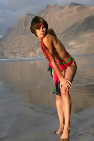 Short haired cutie posing on the beach photo 4