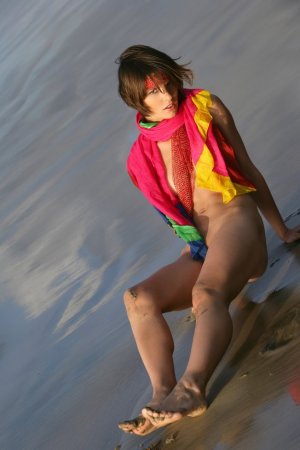 Short haired cutie posing on the beach photo 14