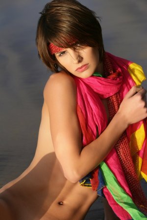 Short haired cutie posing on the beach photo 19