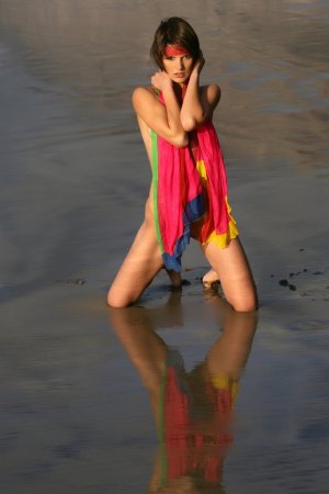 Short haired cutie posing on the beach photo 20