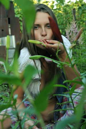 Cutie plays with her body in the flower garden photo 20