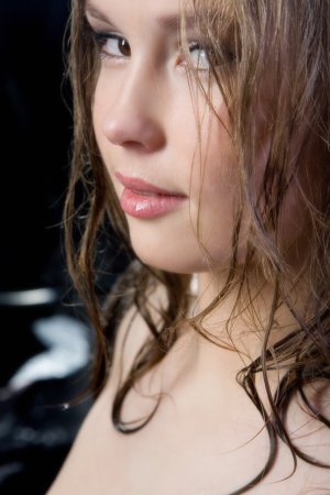Naughty brunette rubs body during a photo session photo 10