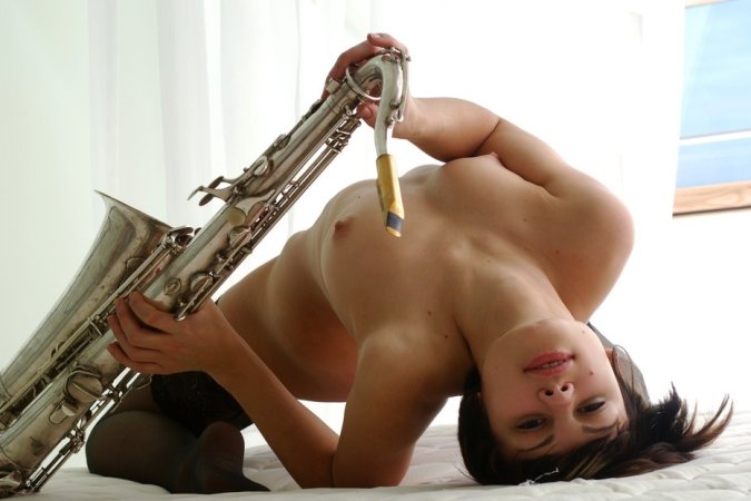 Sexy saxophone player takes off her sexy lingerie. photo 20