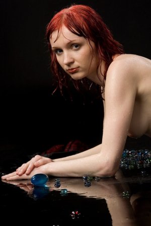 Ginger babe poses under streams of warm water. photo 8