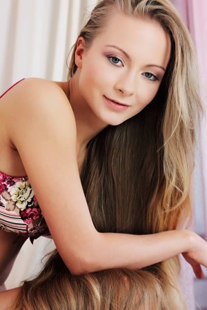 Gorgeous young lady is demonstrating great solo skills photo 4