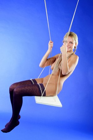 Hot blonde in purple stockings is having solo photo 7
