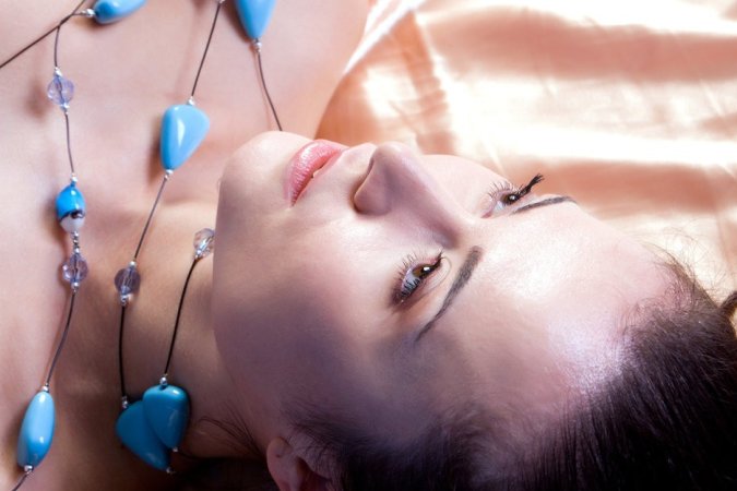 Brunette caresses body with blue beads photo 4
